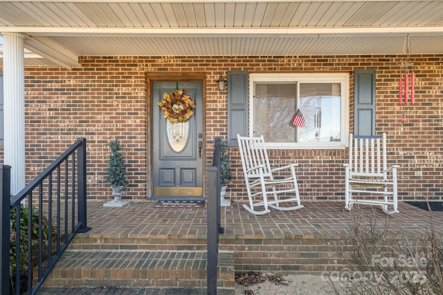 property entrance with covered porch