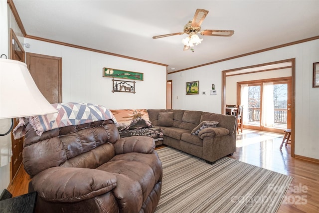 living room with ceiling fan, crown molding, and light hardwood / wood-style floors