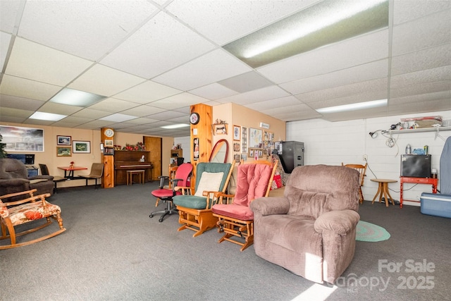 interior space with a drop ceiling and carpet