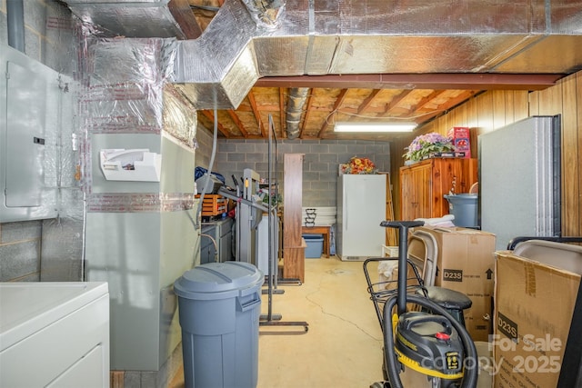 basement featuring washer / dryer and electric panel