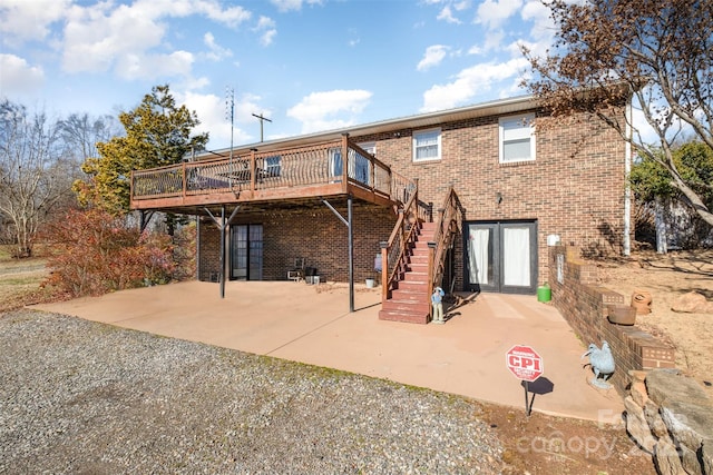 back of house with a patio area and a deck