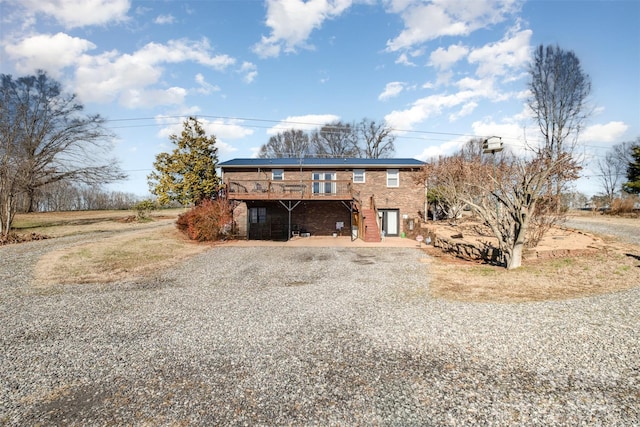 exterior space featuring a wooden deck