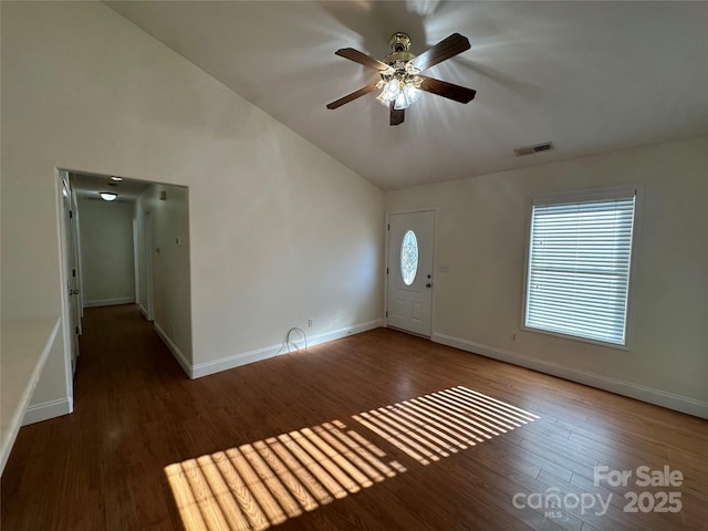 foyer with ceiling fan, dark hardwood / wood-style floors, and lofted ceiling