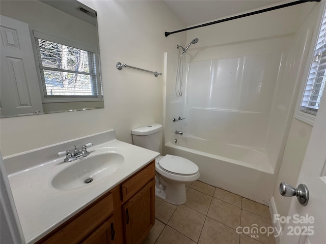 full bathroom featuring toilet, tile patterned floors, vanity, and bathtub / shower combination