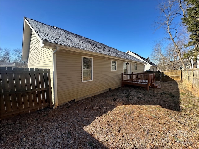 back of house featuring a deck