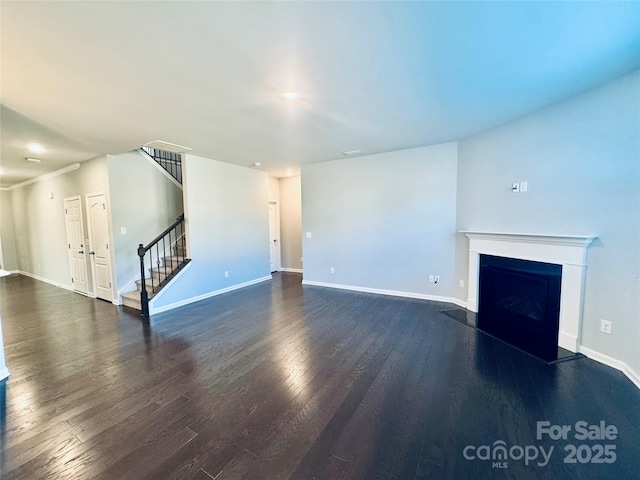 unfurnished living room with dark wood-type flooring