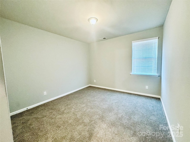 unfurnished room featuring carpet flooring