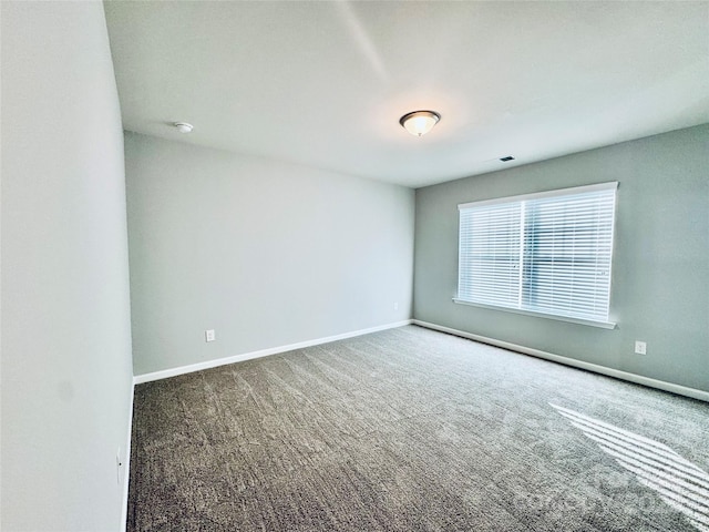 empty room with carpet flooring