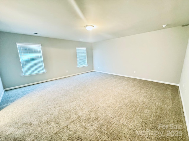 unfurnished room with carpet flooring