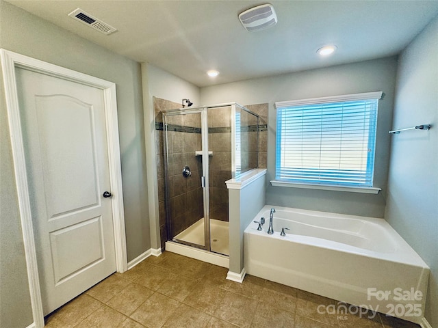 bathroom featuring separate shower and tub and tile patterned floors