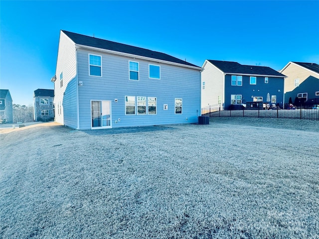 rear view of property with central AC unit