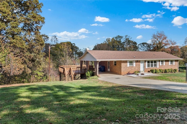 single story home with a carport, a deck, and a front yard