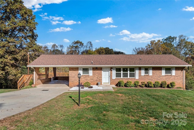 ranch-style house with a carport and a front yard