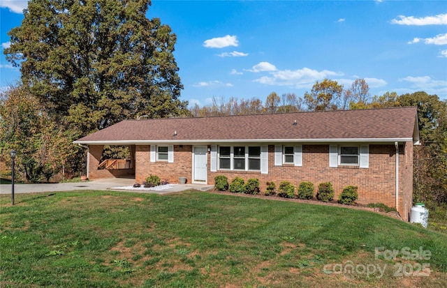 single story home with a front lawn and a carport