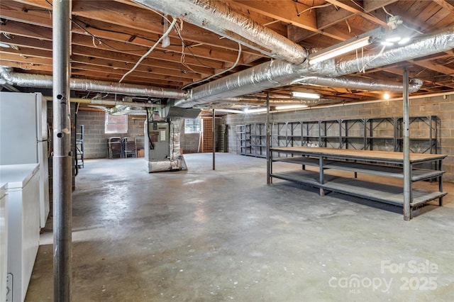 basement with washer / dryer and heating unit