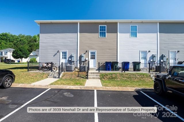 back of property featuring central air condition unit