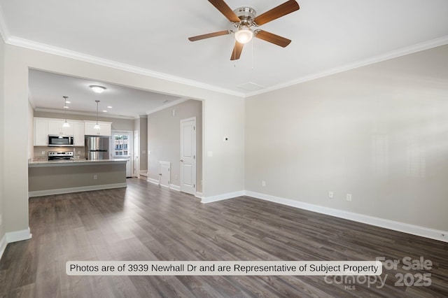 unfurnished living room featuring crown molding, ceiling fan, and dark hardwood / wood-style floors