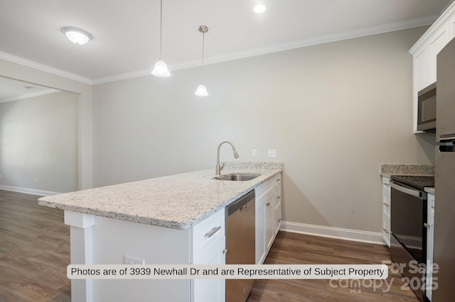 kitchen with sink, hanging light fixtures, kitchen peninsula, white cabinets, and appliances with stainless steel finishes