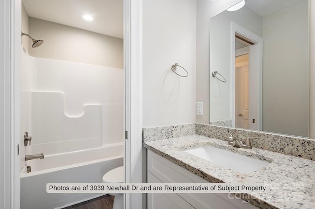 full bathroom featuring vanity, toilet, and shower / tub combination