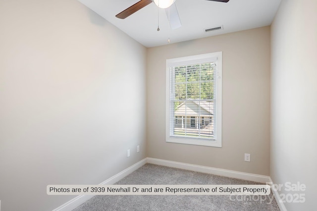 unfurnished room featuring ceiling fan and carpet floors