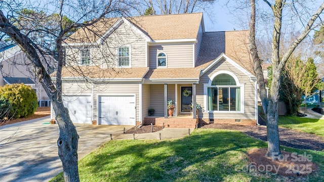 view of front of property with a garage and a front yard