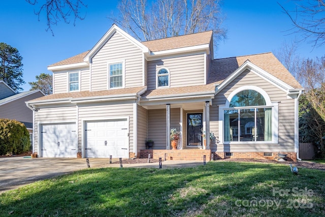 view of front facade with a garage and a front yard