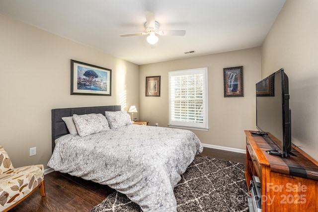 bedroom featuring ceiling fan and dark hardwood / wood-style flooring