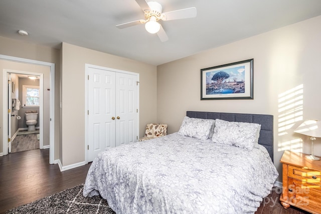 bedroom featuring connected bathroom, a closet, dark wood-type flooring, and ceiling fan