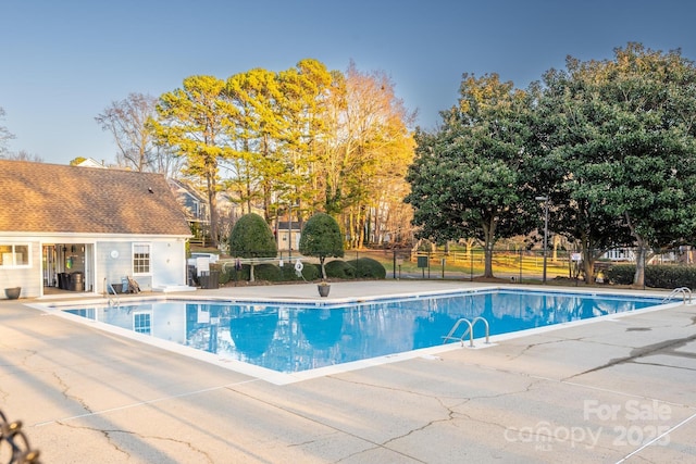 view of swimming pool featuring a patio area