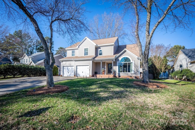 view of front property with a garage and a front yard