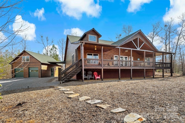 rear view of house with a porch and a garage