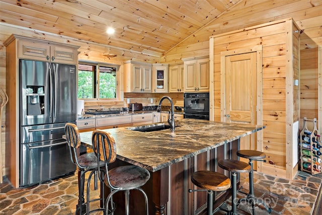 62 N Bear Cliff Dr, Nebo, NC 28761 - kitchen with stainless steel fridge, a sink, stone flooring, and lofted ceiling
