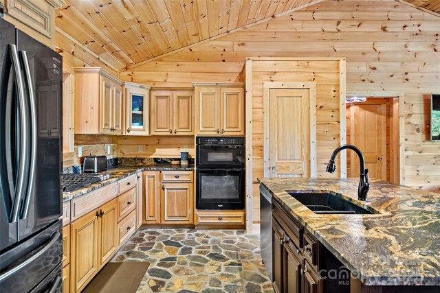 62 N Bear Cliff Dr, Nebo, NC 28761 - kitchen with wooden walls, stone floors, a sink, stainless steel appliances, and vaulted ceiling
