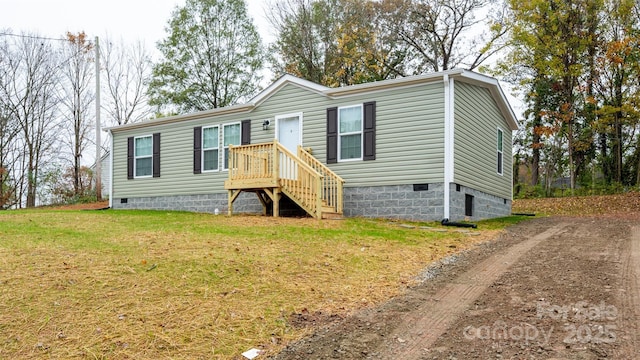 manufactured / mobile home with a front yard