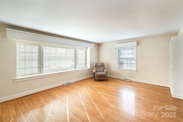 unfurnished room featuring light hardwood / wood-style flooring