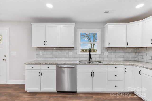 kitchen with white cabinetry, dishwasher, sink, dark hardwood / wood-style flooring, and light stone counters