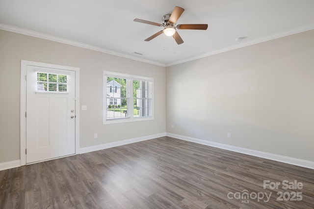 foyer with dark hardwood / wood-style floors, ceiling fan, ornamental molding, and a wealth of natural light