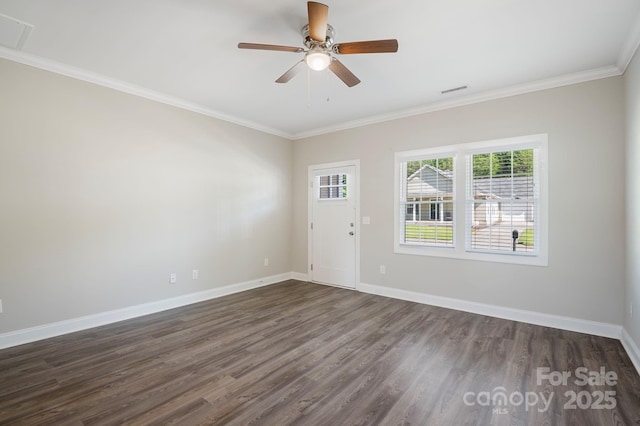 spare room featuring dark hardwood / wood-style floors, ceiling fan, and ornamental molding