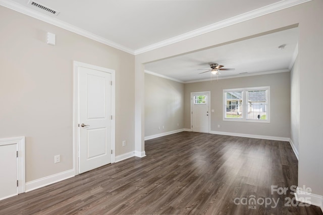 spare room featuring ceiling fan, dark hardwood / wood-style flooring, and ornamental molding