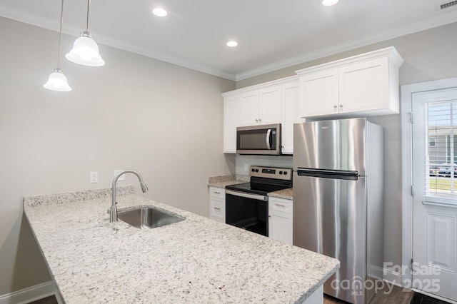 kitchen with sink, white cabinets, and appliances with stainless steel finishes