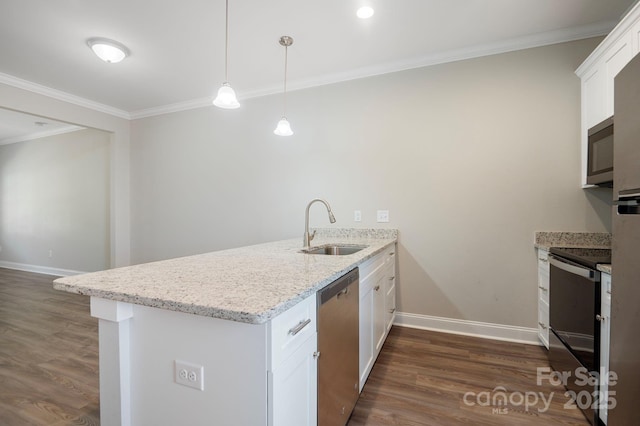 kitchen with white cabinets, appliances with stainless steel finishes, kitchen peninsula, and sink