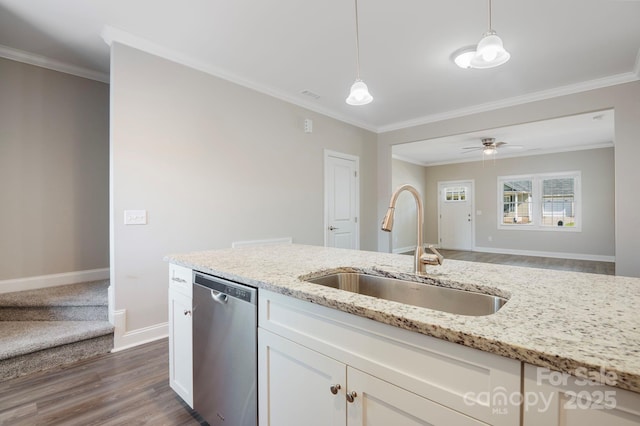 kitchen featuring dishwasher, sink, hanging light fixtures, light stone counters, and white cabinets