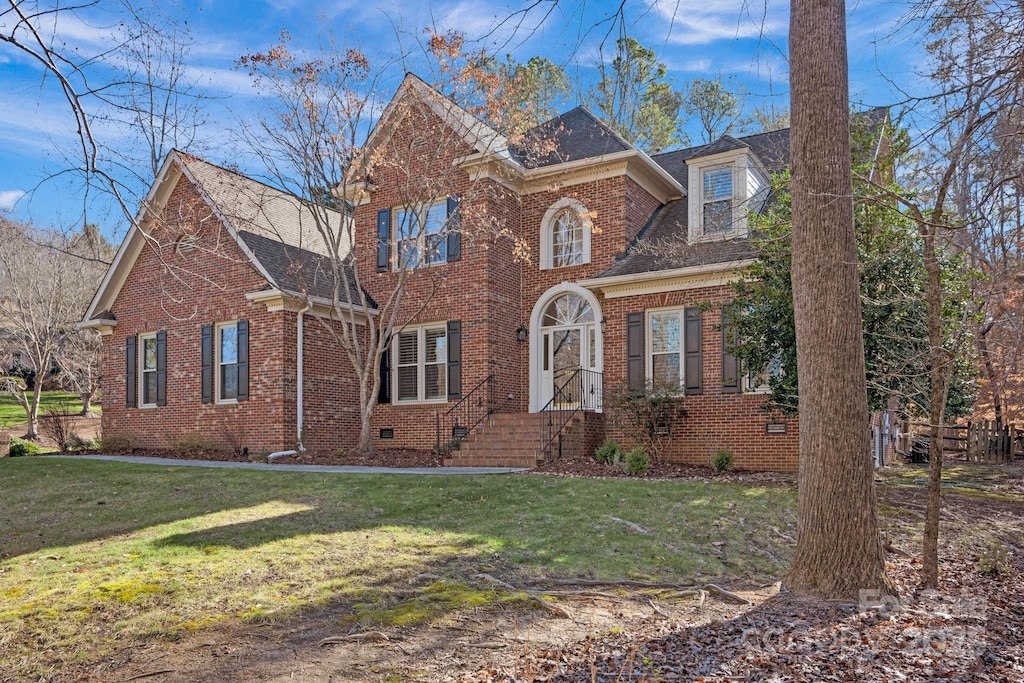 view of property featuring a front yard