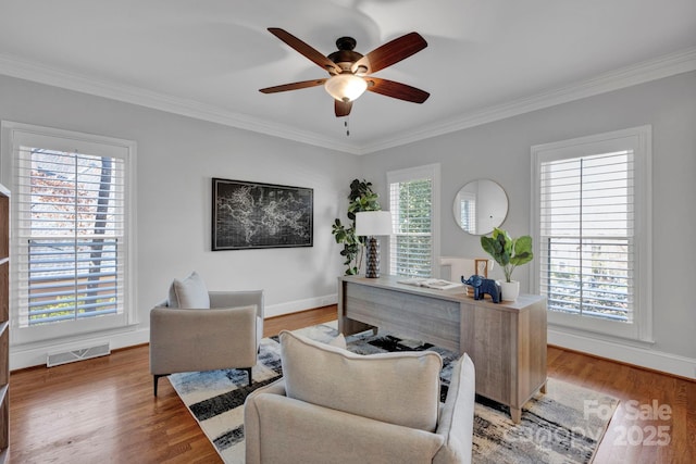 home office with ceiling fan, hardwood / wood-style floors, and ornamental molding