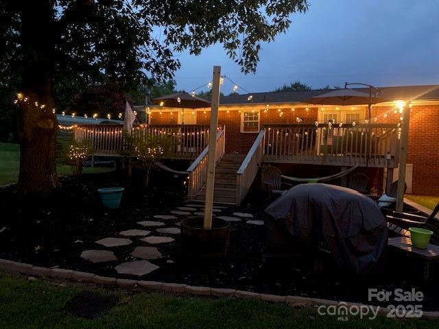 playground at dusk with a wooden deck