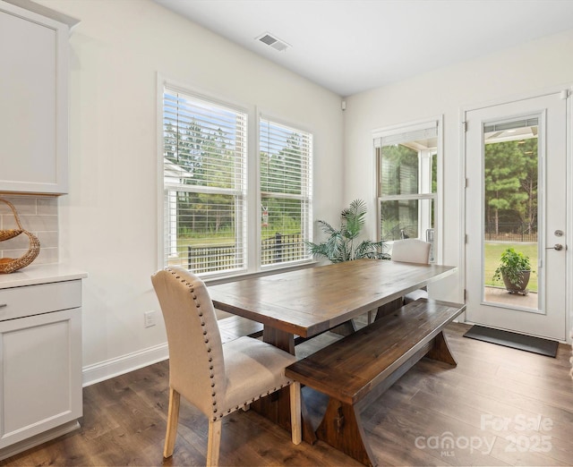 dining area with dark hardwood / wood-style floors