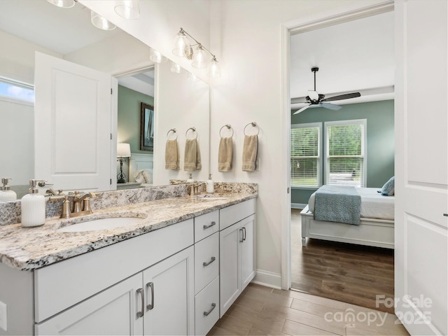 bathroom featuring vanity, hardwood / wood-style flooring, and ceiling fan