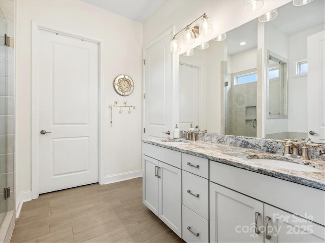 bathroom with vanity and walk in shower