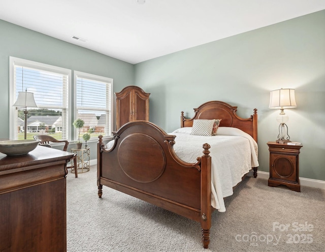 bedroom featuring light colored carpet