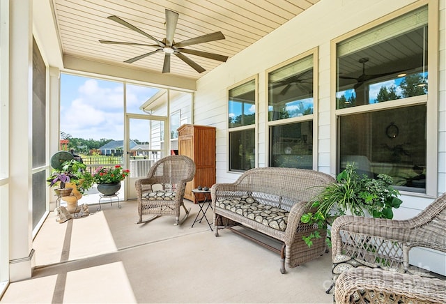 sunroom / solarium with ceiling fan